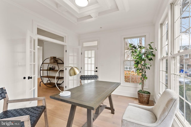 home office featuring french doors, light hardwood / wood-style floors, and ornamental molding