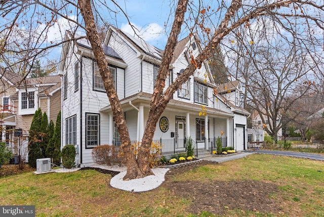 front facade with a porch and a front yard