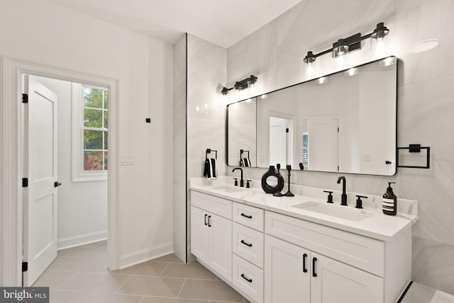 bathroom featuring tile patterned flooring and vanity