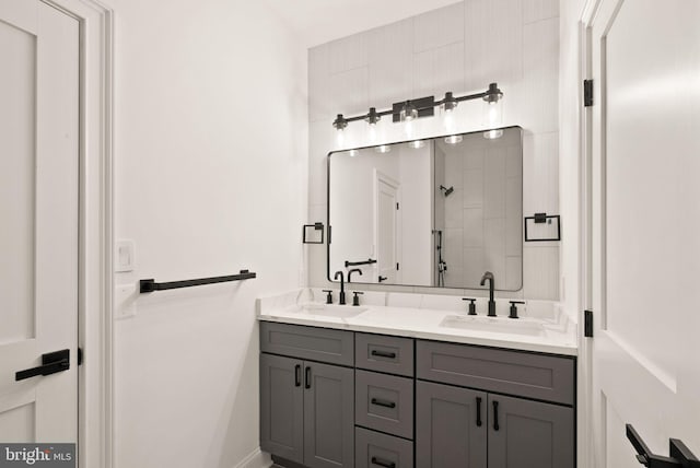 bathroom with vanity and a shower