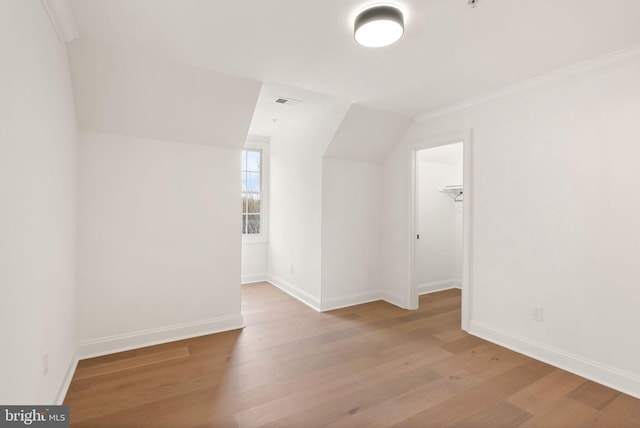 bonus room featuring light wood-type flooring