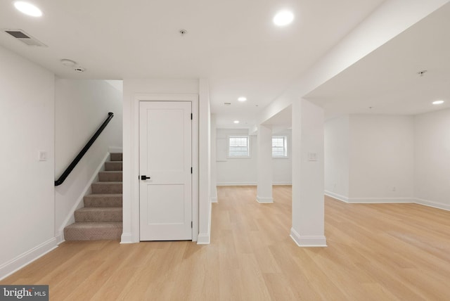 basement featuring light hardwood / wood-style flooring