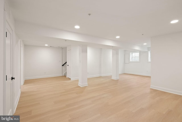 basement featuring light hardwood / wood-style flooring