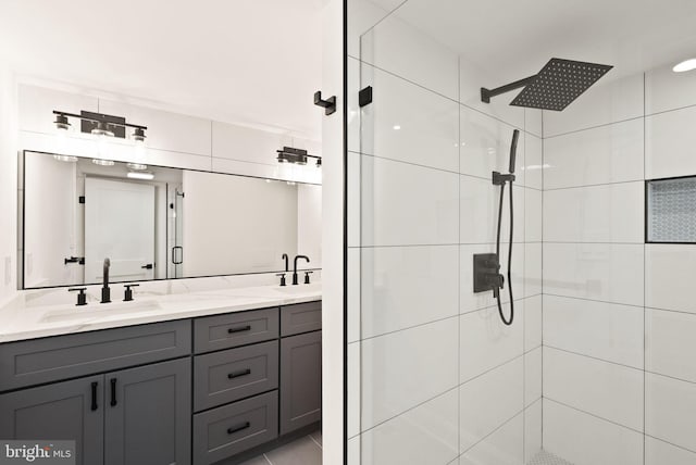 bathroom with vanity and a shower with shower door