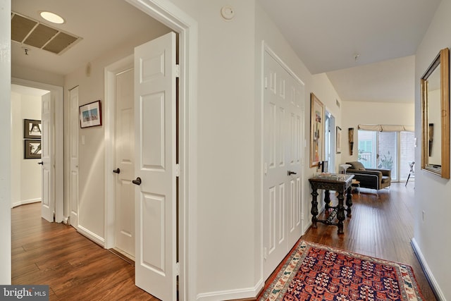 hallway with hardwood / wood-style flooring