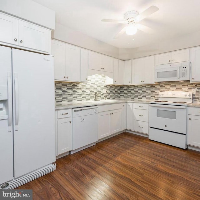 kitchen featuring ceiling fan, white cabinets, sink, white appliances, and dark wood-type flooring