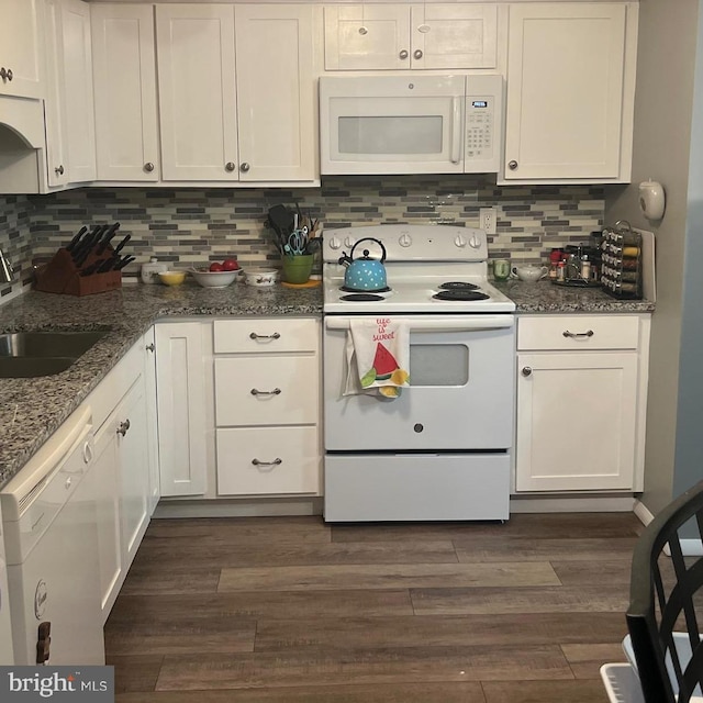 kitchen featuring dark hardwood / wood-style floors, white appliances, and white cabinetry