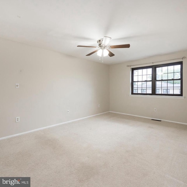 carpeted empty room with ceiling fan