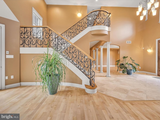 52 Violets Path, Elizabethtown, PA 17022 - foyer entrance featuring a towering ceiling, decorative columns, baseboards, a chandelier, and stairs