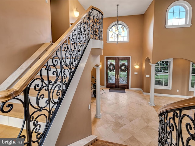 52 Violets Path, Elizabethtown, PA 17022 - entryway with arched walkways, a chandelier, french doors, a high ceiling, and stairs
