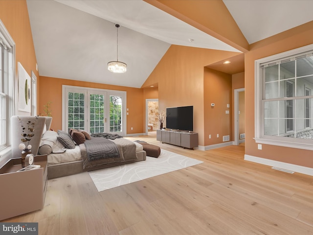 52 Violets Path, Elizabethtown, PA 17022 - living room featuring light wood-type flooring, high vaulted ceiling, a chandelier, and baseboards