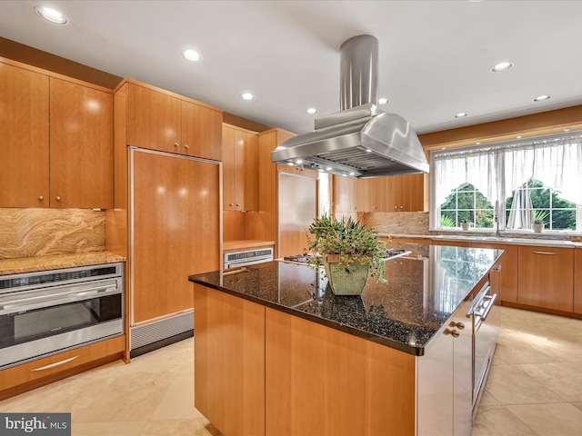 52 Violets Path, Elizabethtown, PA 17022 - kitchen featuring stainless steel appliances, island range hood, a kitchen island, backsplash, and dark stone counters