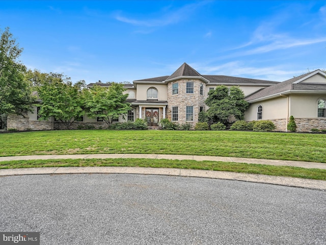 52 Violets Path, Elizabethtown, PA 17022 - view of front of home with stucco siding, stone siding, and a front yard