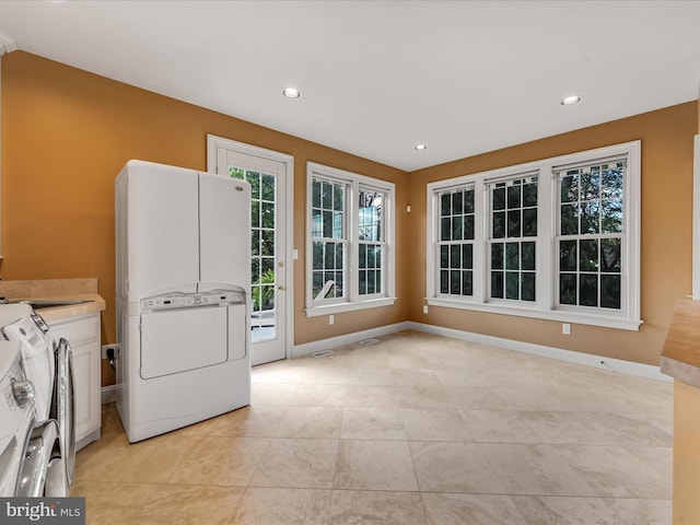 52 Violets Path, Elizabethtown, PA 17022 - washroom featuring light tile patterned floors, cabinet space, recessed lighting, baseboards, and washer / dryer