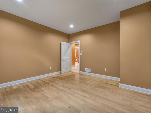 unfurnished room featuring light hardwood / wood-style flooring