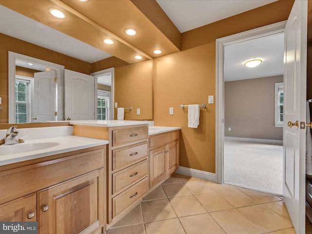 bathroom featuring tile patterned flooring and vanity