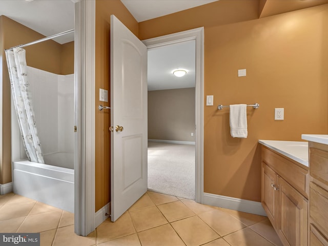 bathroom featuring tile patterned floors, shower / bath combo, and vanity