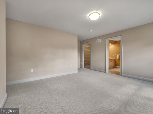 interior space featuring light colored carpet