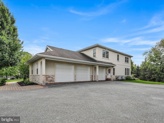 52 Violets Path, Elizabethtown, PA 17022 - traditional-style home with stucco siding, stone siding, an attached garage, and driveway