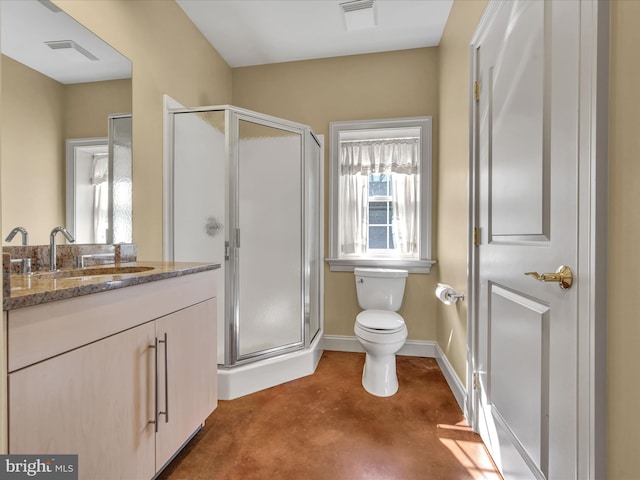 bathroom featuring concrete flooring, vanity, toilet, and a shower with door