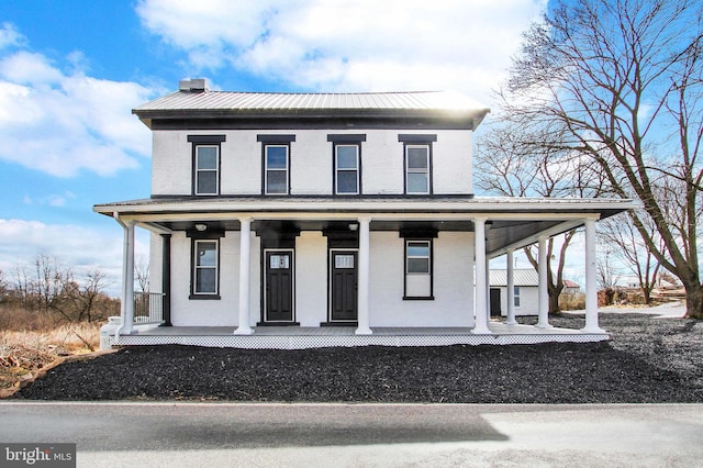 farmhouse inspired home with a porch