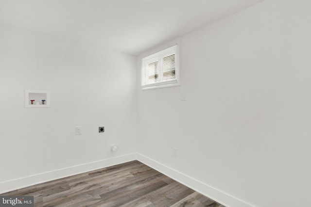 clothes washing area with hookup for a washing machine, hardwood / wood-style floors, and hookup for an electric dryer