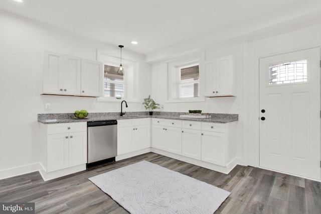 kitchen with white cabinetry, dishwasher, dark wood-type flooring, and decorative light fixtures