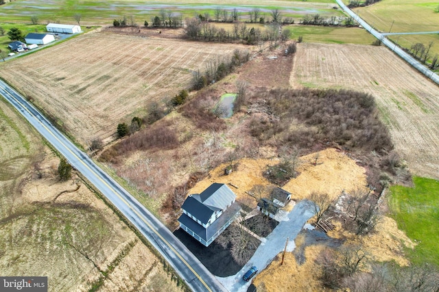 birds eye view of property featuring a rural view