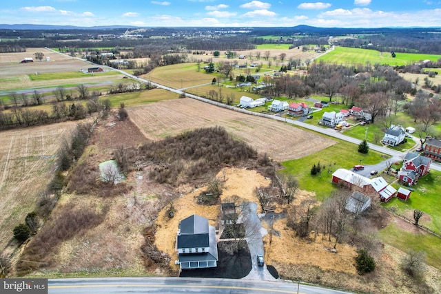 birds eye view of property featuring a rural view