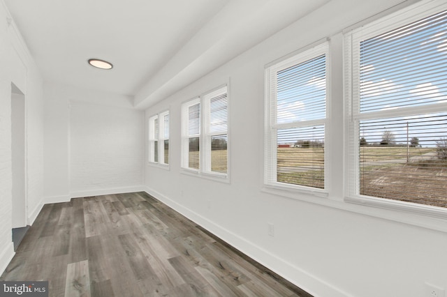 spare room with hardwood / wood-style floors