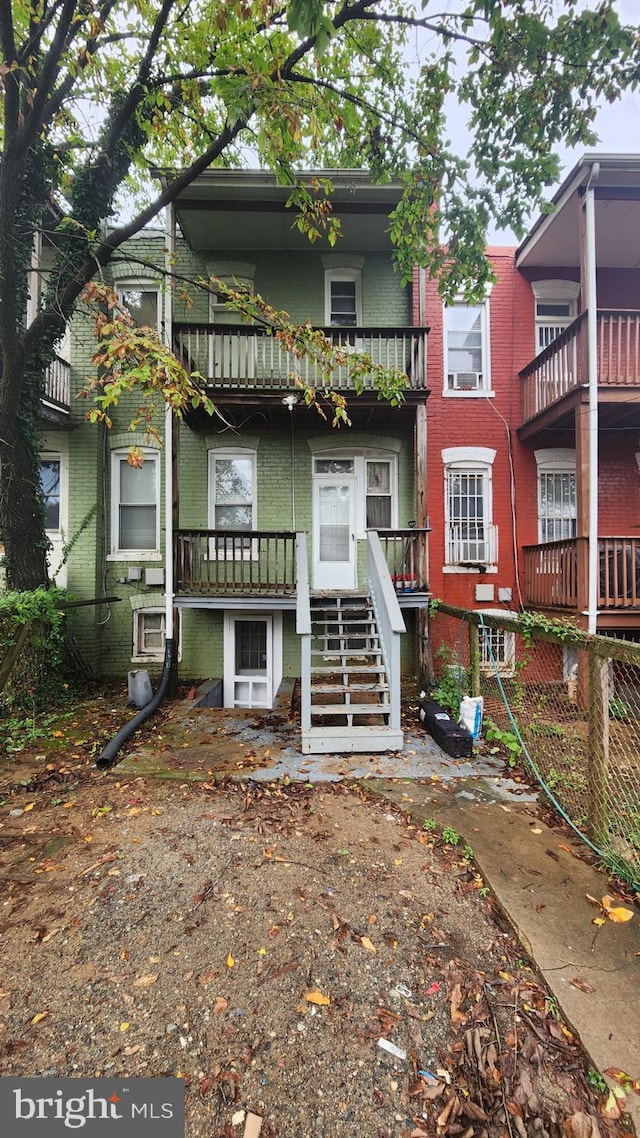 view of front of property with a balcony