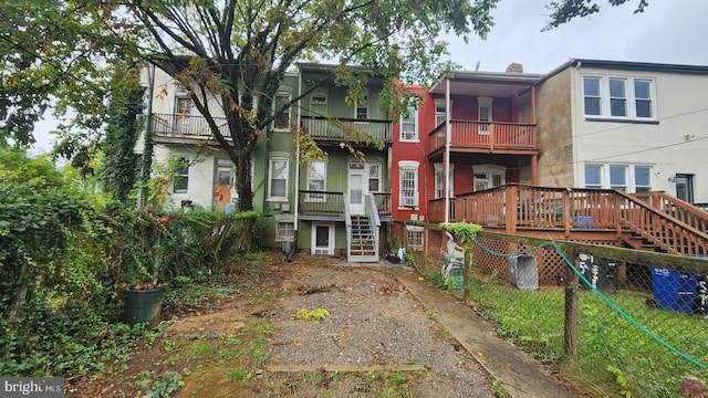 rear view of property with a balcony