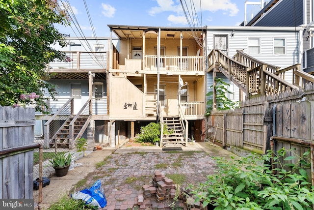 back of house with a patio