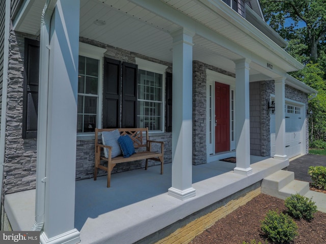 view of patio featuring a garage and covered porch