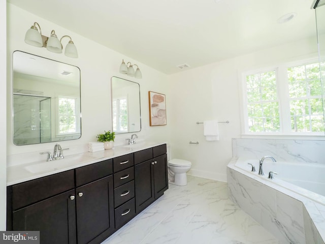 full bathroom featuring independent shower and bath, vanity, and toilet