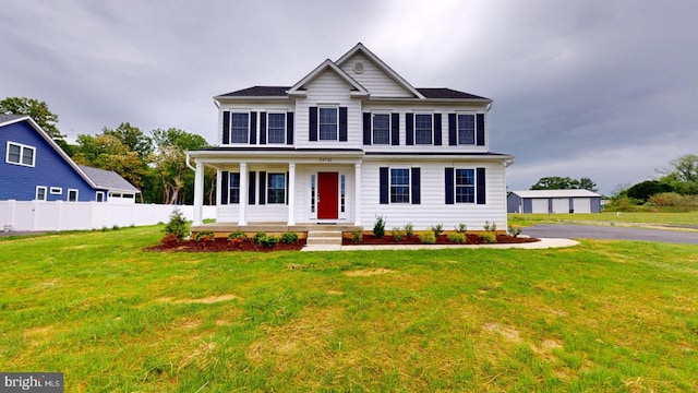 view of front facade featuring a garage and a front lawn