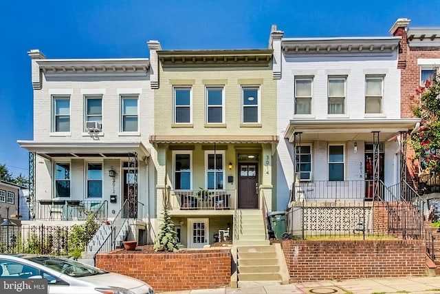 multi unit property featuring a porch