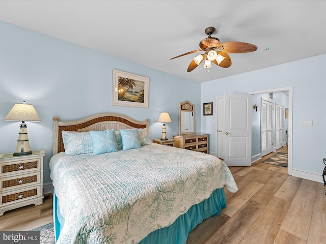 bedroom featuring light hardwood / wood-style flooring and ceiling fan