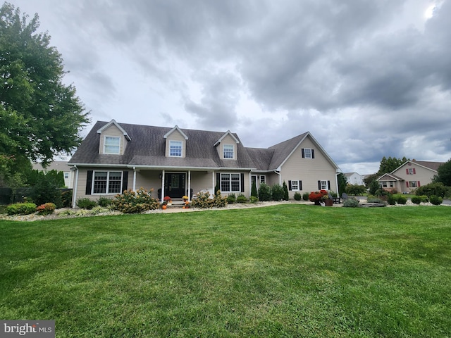 cape cod house with a porch and a front yard