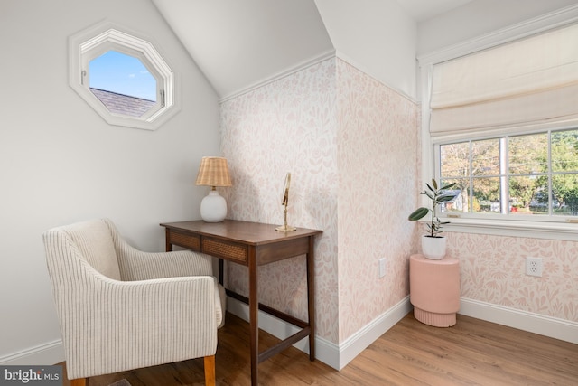 office area with lofted ceiling, hardwood / wood-style flooring, and a healthy amount of sunlight