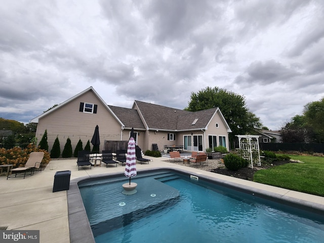 view of swimming pool featuring a patio area