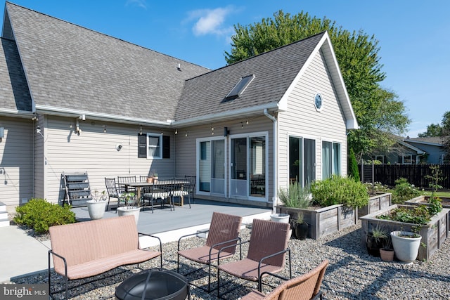 back of house with a patio area