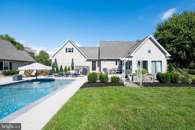 rear view of property with a patio area and a yard