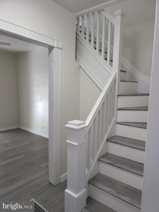 stairway featuring hardwood / wood-style floors