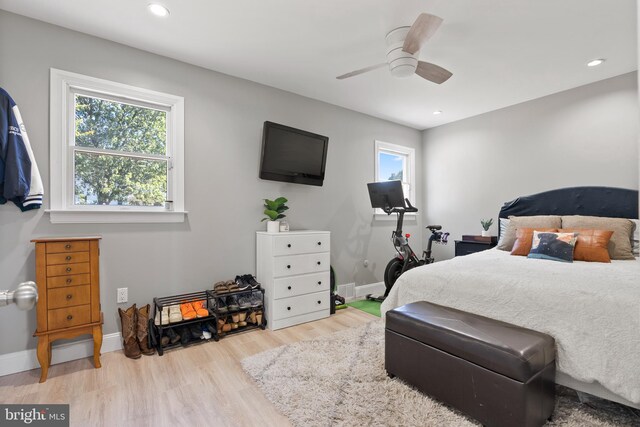 bedroom featuring ceiling fan and light hardwood / wood-style floors