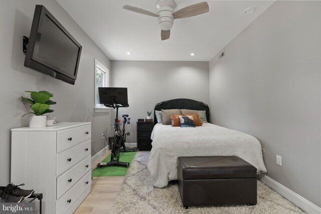 bedroom featuring ceiling fan and light hardwood / wood-style flooring