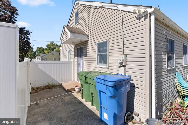 view of side of home with a patio