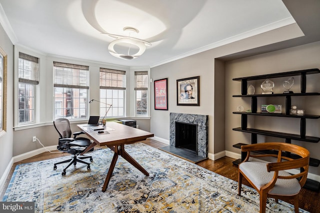 office with ornamental molding, a fireplace, and dark hardwood / wood-style flooring