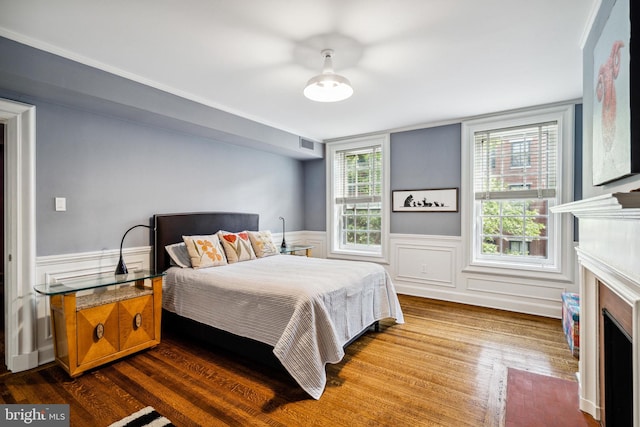 bedroom with hardwood / wood-style floors