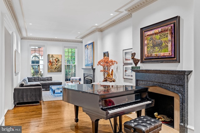 miscellaneous room featuring light wood-type flooring and crown molding